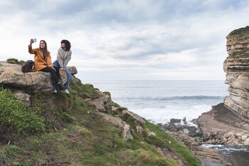 Travel Trends Report - woman posing by view